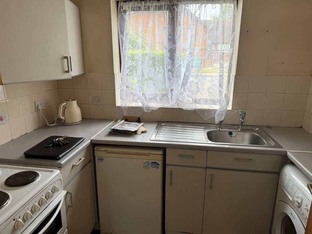 Lot: 120 - GROUND FLOOR FLAT WITH PARKING IN NEED OF UPDATING - Kitchen at rear with window and fitted units